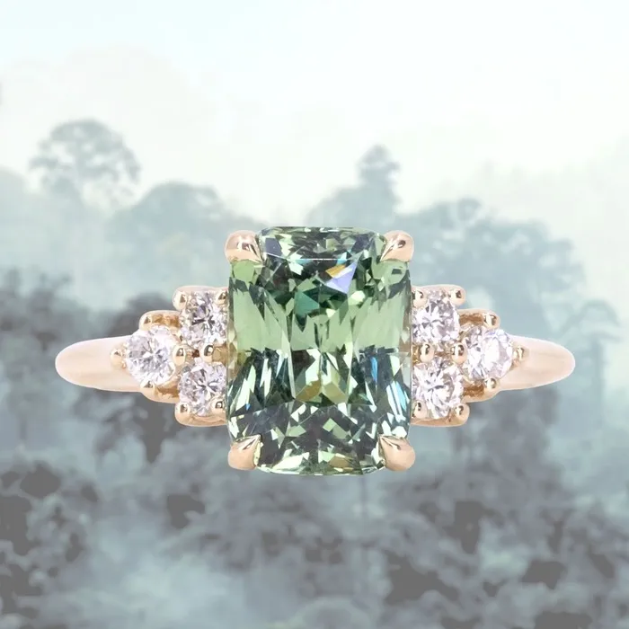 Anueva Jewelry Rings 353ct Blue Green Untreated Radiant Cut Sapphire and Diamond Cluster Ring in 14k Yellow Gold Anueva Jewelry Rings 353ct Blue Green Untreated Radiant Cut Sapphire and Diamond Cluster Ring in 14k Yellow Gold