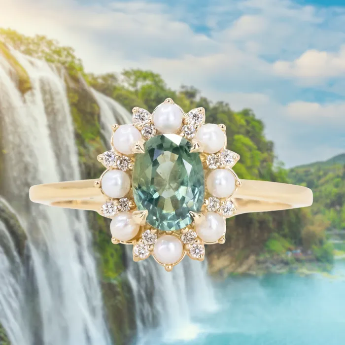 Rings Anueva Jewelry 097ct Oval Teal Montana Sapphire Low Profile Diamond and Pearl Halo Ring in 14k Yellow Gold Rings Anueva Jewelry 097ct Oval Teal Montana Sapphire Low Profile Diamond and Pearl Halo Ring in 14k Yellow Gold